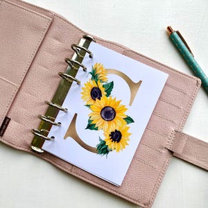 Planificador con monograma de girasol, inserto con estampado floral otoñal para carpetas de 6 anillas y diarios.