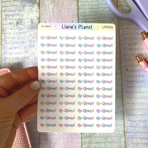 May include: A rectangular sticker sheet featuring forty-eight individual stickers with the text No Spend in a cursive font. The text displays a gradient of pastel colours including pink, blue, and yellow. The sheet is labelled Liane's Plans! LP0104.