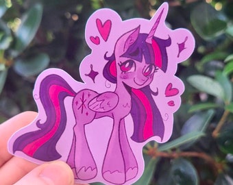 May include: A purple and pink cartoon unicorn with a pink horn, a purple mane, and a pink tail. The unicorn is smiling and has hearts and stars around it.