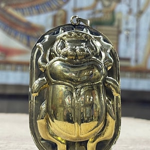 Ancient Egyptian scarab pendant made from Brass, Egyptian Scarab with Eye of Ra, Eye of Horus, Customized materials available.