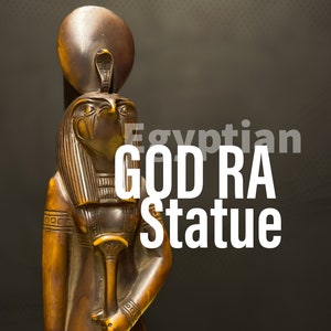 RA the god of sun with falcon face and wearing Sun disc with the Cobra - made in Egypt.
