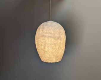 Lampe type baladeuse petit cocon NID en laine feutrée