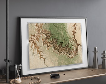 May include: A framed topographic map print of a canyon landscape in shades of green, brown, and beige. The map shows the elevation changes and contours of the canyon.