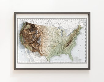 May include: A vintage-style relief map of the United States, showing the topography of the country in shades of brown, green, and blue. The map is framed in a gray frame.