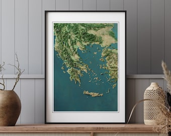 May include: A framed map of Greece with a detailed topographic relief showing the country's mountainous terrain and surrounding islands. The map is printed in shades of green, blue, and brown, and is set against a white background.