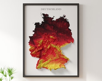 May include: A framed 3D map of Germany with a textured surface, coloured in shades of red, yellow, and black. The map is titled "DEUTSCHLAND" in black text.