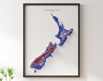 May include: A framed map of New Zealand with a 3D topographic relief effect. The map is printed in shades of blue and red, with the highest elevations shown in red.
