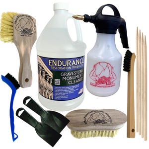 May include: A gravestone cleaning kit including a large jug of Endurance Restoration Products cleaner, a white spray bottle, two wooden-handled brushes with light bristles, a blue-handled brush, two black scrapers, and four wooden pointed sticks.