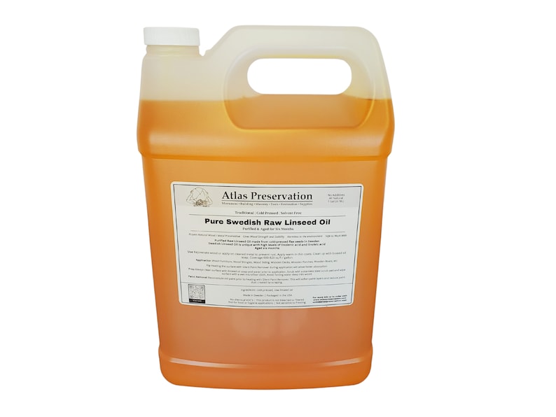 May include: A gallon jug of pure Swedish raw linseed oil from Atlas Preservation. The label states that the oil is cold-pressed, traditional, and perfect for wood finishes.