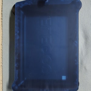 May include: A blue plastic tray with a raised "GoPro" logo. The tray has two black knobs on the top and two suction cups on the bottom.