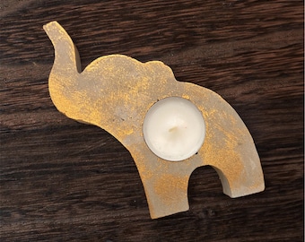 Portavelas de hormigón pintado a mano con forma de elefante, detalles dorados, decoración espiritual.
