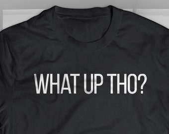 May include: Black t-shirt with the text "WHAT UP THO?" printed in white on the front.