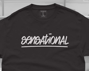 May include: Black t-shirt with the word "SENSATIONAL" written in white on the front.