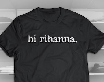 May include: Black t-shirt with the text "hi rihanna." printed in white.