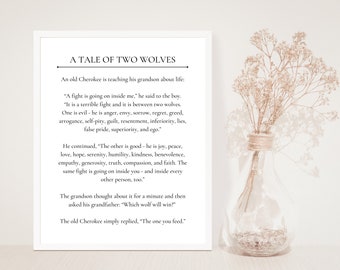 May include: A white framed print with a black and white text quote about the "Tale of Two Wolves". The quote is about the internal struggle between good and evil. The print is on a wooden surface with a bouquet of dried flowers in a glass vase.