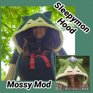 May include: A dark teal crochet hood with pointed ears and a cream-coloured face panel featuring closed eyes, labelled Sleepymon Hood. A second green crochet hood with a blue flower on top and a cream face panel is labelled Mossy Mod.