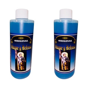 May include: Two blue bottles with white caps and labels that say "ORIGINAL Ataque y Defensa". The labels feature a picture of a person in armor holding a flag.