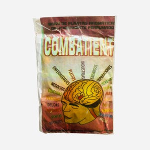 May include: A clear plastic bag with the word "COMBATENT" in large, yellow letters. The bag features a graphic of a brain and various Spanish words like "ENFERMEDADES" and "NEGOCIOS". The top of the bag has text in Spanish.