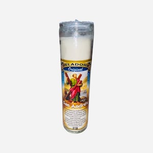 May include: White candle in a glass jar with a picture of Saint Andrew on the front. The label reads "Veladora Original San Andrés".