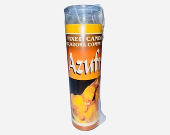 Puede incluir: Una vela amarilla y naranja con el texto "Fixed Candle Veladora Compu Azufre" en la etiqueta. La vela está envuelta en plástico.