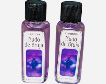 May include: Two small, clear bottles filled with a purple liquid. Each bottle has a black cap and a white label with the text "Esencia Nudo de Bruja" and a blue and purple graphic. The bottles are labeled "8 ml. 1/4 Fl oz."
