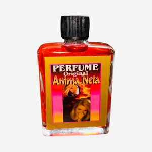 May include: A small, clear glass bottle with a black cap filled with a red liquid. The bottle has a gold label with the text "PERFUME Original Anima Neta" and a picture of a woman.