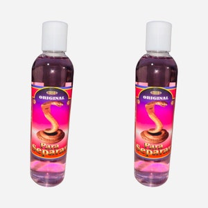 May include: Two clear glass bottles with pink liquid and white caps. The labels are red and gold with a snake image and the text "ORIGINAL" and "Para Separar".