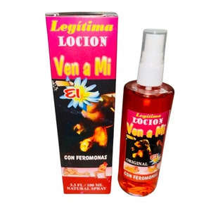 May include: A red bottle of Legítima Ven a Mi lotion with a white spray nozzle. The bottle is labeled with the text "Legítima Loción Ven a Mi" and "Con Feromonas". The bottle is 3.3 fl oz / 100 ml and is a natural spray.
