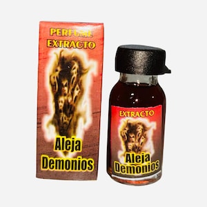 May include: A small glass bottle with a black cap and a matching box. Both the bottle and box have a red label with the word "EXTRACTO" and the words "Aleja Demonios" in yellow. The label also features a graphic of a multi-faced creature.