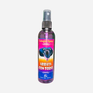 May include: A clear glass bottle with a purple liquid and a black spray nozzle. The label is pink, blue, and yellow with a black snake head and the text "Cologne Spray" and "Arrasa Con Todo". The bottle contains 125 ml of cologne.