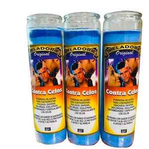 May include: Three blue glass candle jars with a white label that reads "VELADORA Original" and "Contra Celos". The label also includes text in Spanish about the candle's purpose.
