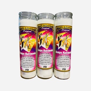 May include: Three white glass candle jars with a pink and yellow label that reads "Veladora Original" and "Rompe Matrimonio". The label features a graphic of a couple with scissors cutting a heart. The text on the label reads: "Asi como se consume esta veladora, se consumira y rompera el matrimonio entre (diga los nombres de la pareja) y asi como se apaga esta luz se apagara para siempre el amor entre ellos, y asi sera."