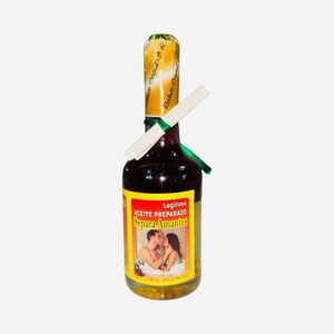 May include: A glass bottle filled with a dark liquid, featuring a yellow and red label with the text "ACEITE PREPARADO Separa Amantes." The bottle is sealed with a gold foil top and a white paper scroll. A green ribbon is tied around the neck.