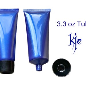 May include: Two blue plastic tubes with black caps, one with the cap on and one with the cap off. The tubes are labeled "3.3 oz Tube".