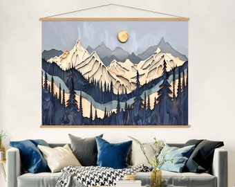 May include: A wall hanging featuring a layered paper art design of a mountain range with a full moon in the sky. The mountains are in shades of blue, brown, and white, with a forest of trees in the foreground. The background is a light blue sky.