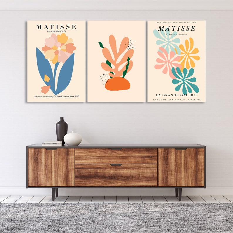 May include: Three framed art prints with a minimalist design featuring abstract floral and leaf shapes in shades of blue, green, orange, pink, and yellow. The prints are titled "Matisse" and feature the text "Papiers Decoupes" and "La Grande Galerie 60 Rue de L'Universite, Paris VII".