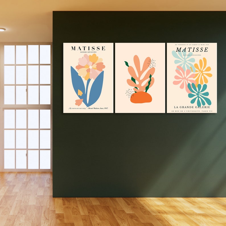 May include: Three Matisse art prints with floral and abstract designs. The prints are in a light pink, blue, green, orange, and yellow color scheme. The text on the prints reads "Matisse" and "La Grande Galerie".