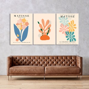 May include: Three abstract art prints featuring colorful floral and leaf designs. The prints are titled "Matisse" and "La Grande Galerie" and feature the text "Papiers Decoupes".