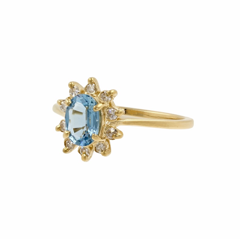 1.35ctw 14k Yellow Gold Oval Blue Topaz Round Diamond Halo Cocktail Ring