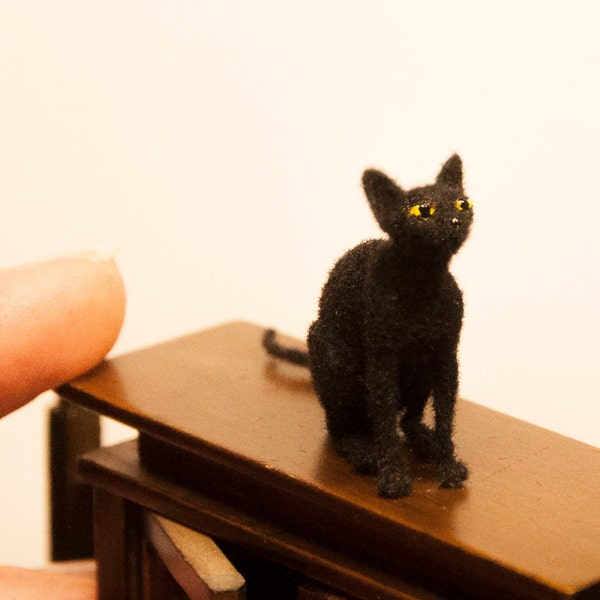 Miniature cat, sitting artisan pet in 1:12 twelfth scale for doll house of diorama. Fluffy black kitten toy