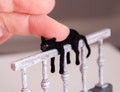Miniature cat, railing artisan pet in 1:12 twelfth scale for doll house of diorama. Fluffy black kitten toy product logo