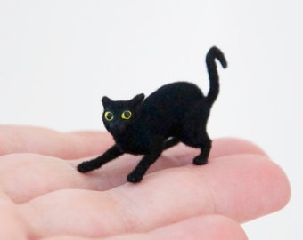 Miniature cat, playful feisty artisan pet in 1:12 twelfth scale for doll house of diorama. Fluffy black kitten toy