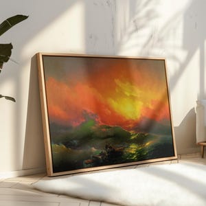 May include: A rectangular framed wall art print featuring a dramatic seascape painting. The scene depicts turbulent dark green ocean waves beneath a vibrant, fiery sky filled with intense orange, red, and yellow clouds at sunset or sunrise.