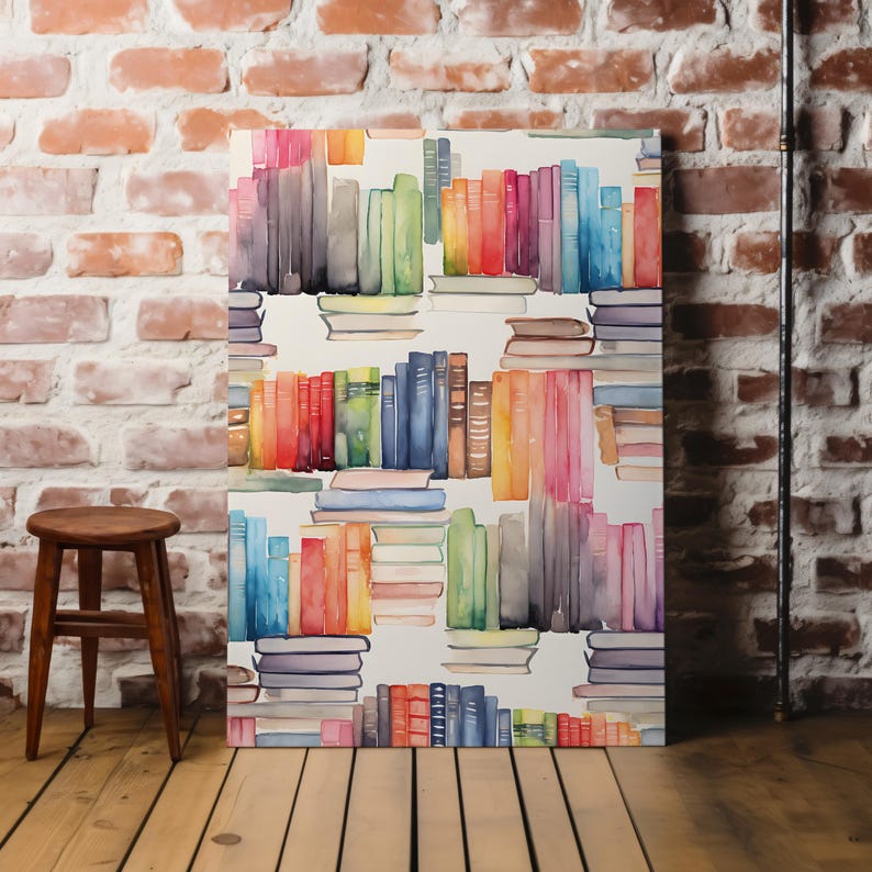 May include: A canvas print featuring a watercolor illustration of stacked books in various colors. The books are arranged in a repeating pattern, with hues of red, orange, yellow, green, blue, and purple. The background is white.
