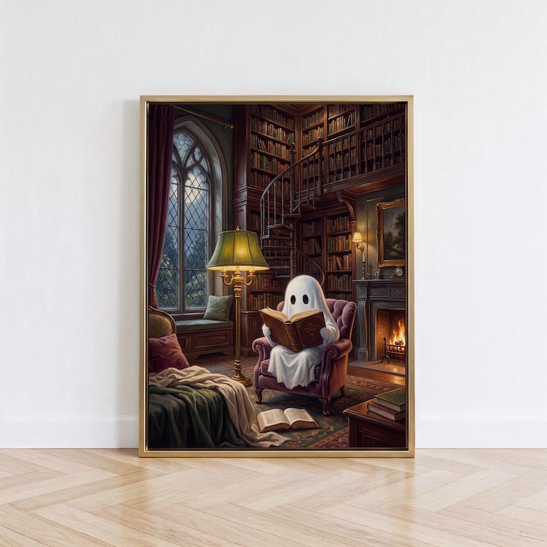 May include: A framed wall art print depicting a white ghost figure sitting in a plush armchair within a library, reading an open book. The scene includes a tall floor lamp, a fireplace with a fire, a spiral staircase, and bookshelves.