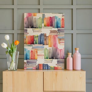 May include: A watercolor painting of colorful books on a white background. The books are stacked in rows and columns, with a variety of colors including red, blue, green, and yellow. Two pink bottles and a vase of tulips sit on a wooden cabinet.