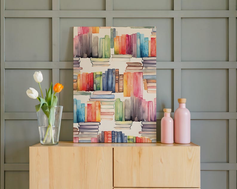 May include: A watercolor painting of colorful books on a white background. The books are stacked in rows and columns, with a variety of colors including red, blue, green, and yellow. Two pink bottles and a vase of tulips sit on a wooden cabinet.