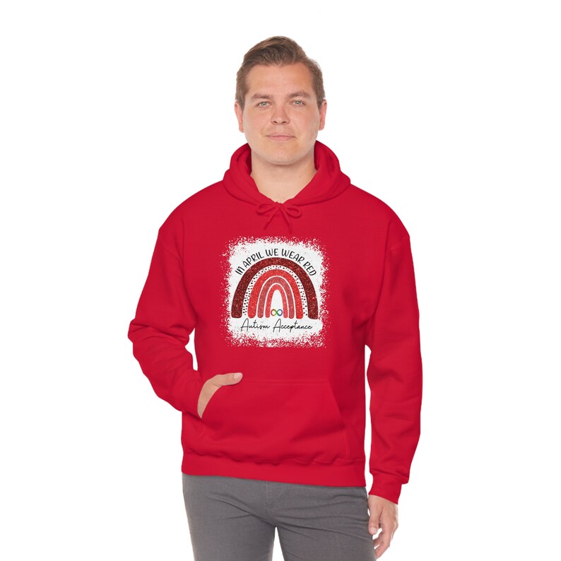 May include: Red hooded sweatshirt with a rainbow graphic and the text "In April We Wear Red Autism Acceptance".