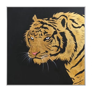 May include: A close-up of a golden tiger's face against a black background. The tiger's fur is detailed with gold paint and its eyes are a piercing green.