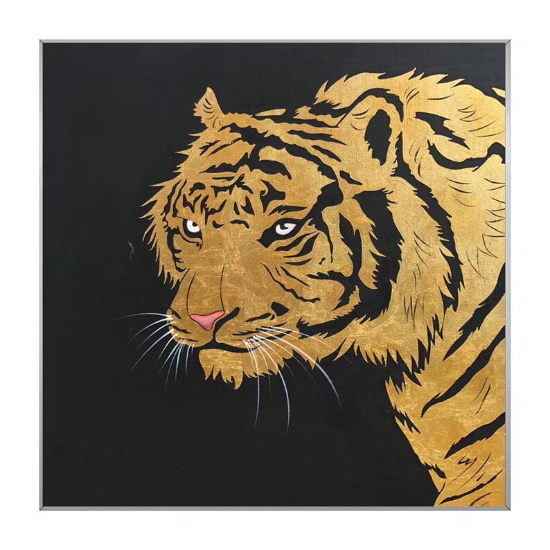 May include: A close-up of a golden tiger's face against a black background. The tiger's fur is detailed with gold paint and its eyes are a piercing green.